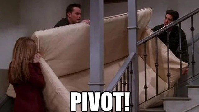 The Friends cast shouting PIVOT! while wrestling a sofa up a staircase